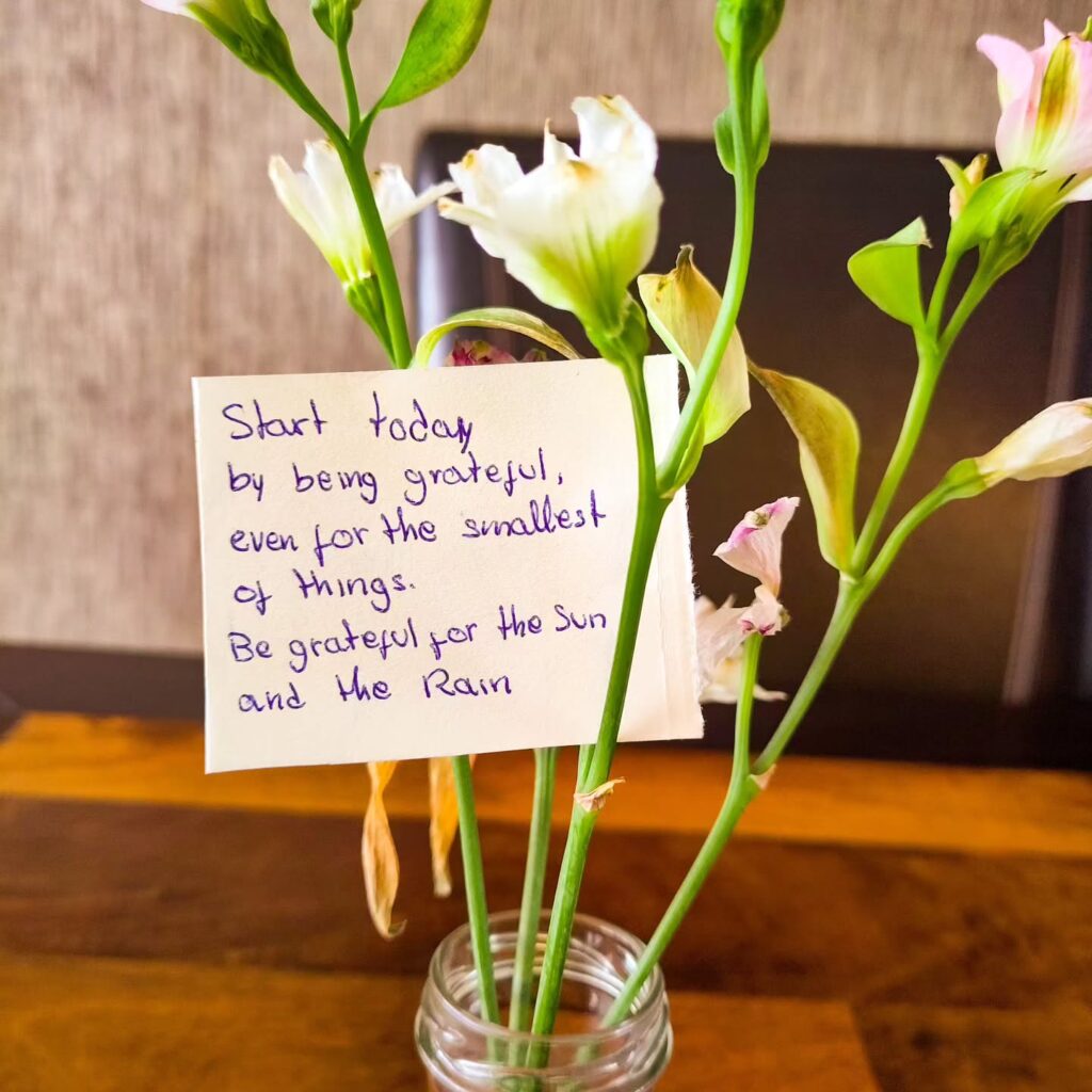 a flower vase with poetry text